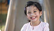 Girl smiling in playground