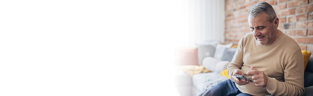 man looking at his cell phone