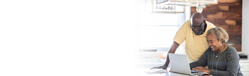 African American couple browsing computer together
