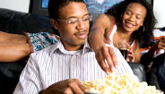 Brother and sister eating popcorn Brother and sister eating popcorn