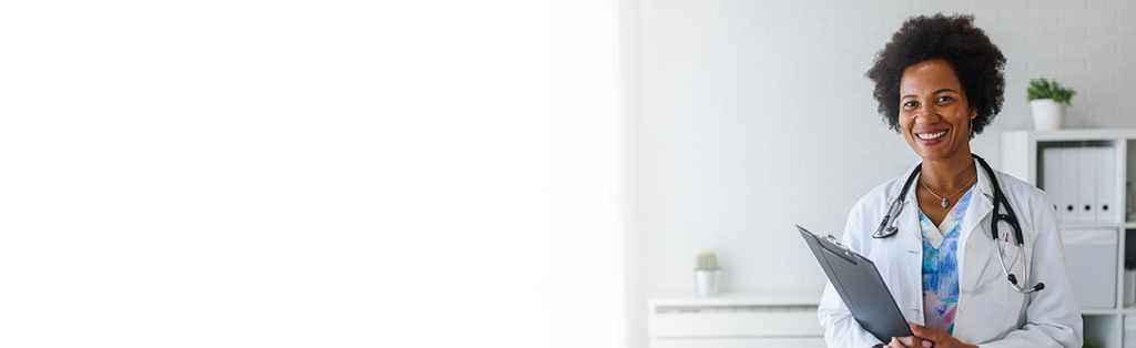 smiling doctor with clipboard