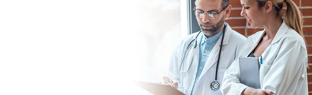 two doctors looking at chart and talking