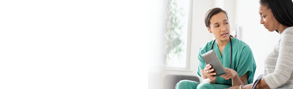 female doctor talking to female patient