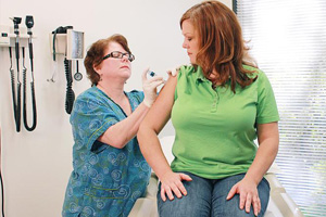 Woman getting flu shot Woman getting flu shot