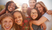group of children embracing and smiling group of children embracing and smiling