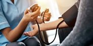 Provider checking patient's blood pressure Provider checking patient's blood pressure