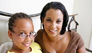 Mother and daughter smiling