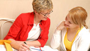 Two women looking at brochures Two women looking at brochures