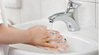 Someone washing hands with soap