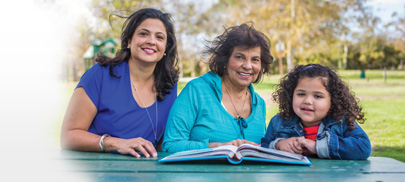 Grandmother Mother Daughter sitting in a table