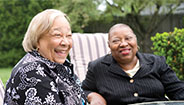 Two elderly ladies laughing