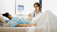 pregnant woman getting checkup pregnant woman getting checkup