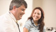 Doctor and patient smiling