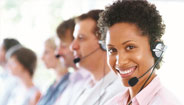 Woman with headset talking to a patient Woman with headset talking to a patient