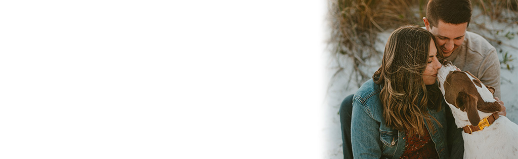 Couple with their dog at the beach